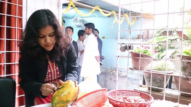 Sapna & other students at work